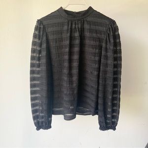 Long-puff-sleeve black lace LOFT brand shirt, button clasp at back of neck.